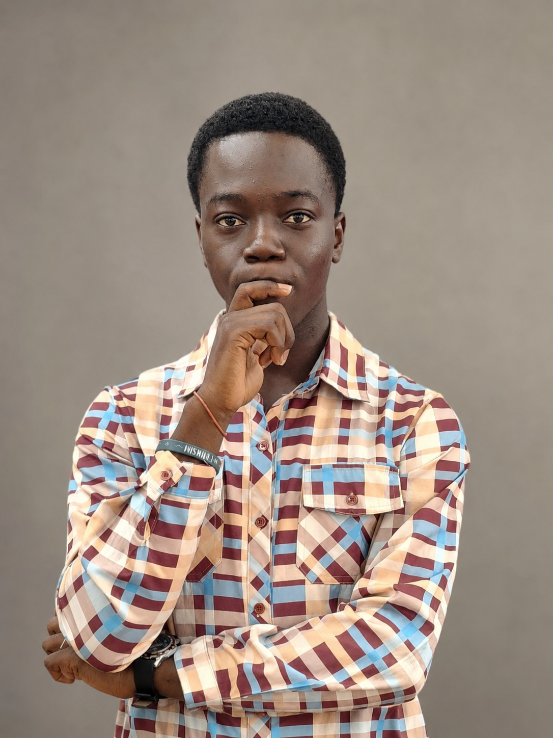 Oluwatobisimi David Ilori in a thoughtful studio portrait